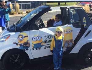 Kid riding the mini car -  arrow plumbing in Libertyville, IL