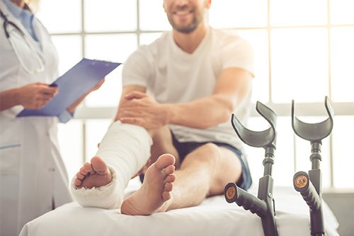 Injured Patient Talking To His Doctor
