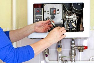HVAC Technician fixing gas heater — Brands and Services in Dumfries, VA