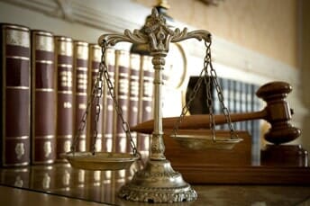 Scales representing justice our intellectual property attorney defends in Pasadena, CA