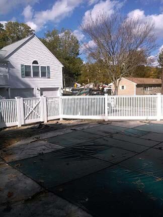 House with white vinyl fence — Closeboard Fence Panels in Bridgewater, MA
